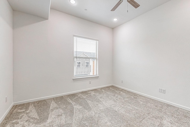 carpeted empty room featuring ceiling fan