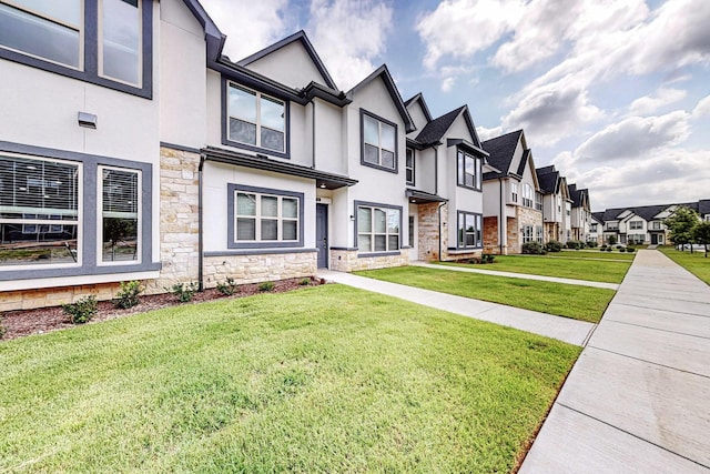 view of front of home featuring a front lawn