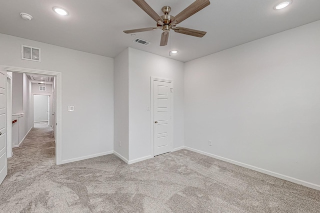 unfurnished bedroom featuring light colored carpet and ceiling fan