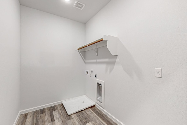 laundry room with hardwood / wood-style flooring, washer hookup, and electric dryer hookup