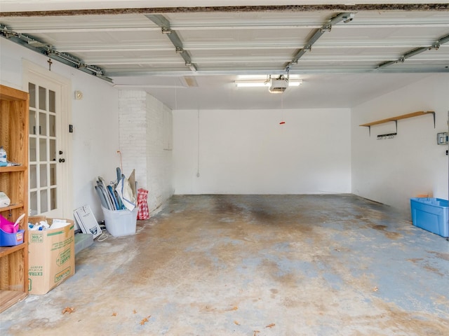 garage with french doors and a garage door opener