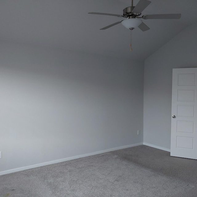 unfurnished room featuring carpet, ceiling fan, and vaulted ceiling