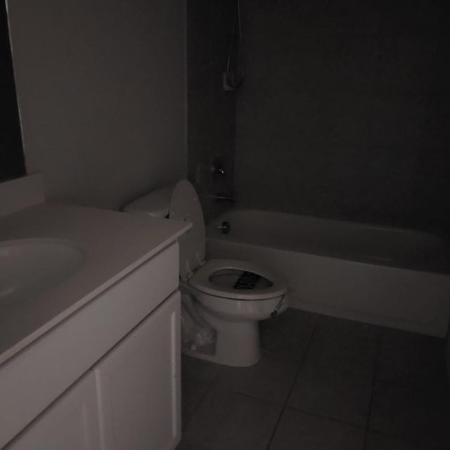 full bathroom featuring tile patterned flooring, vanity,  shower combination, and toilet