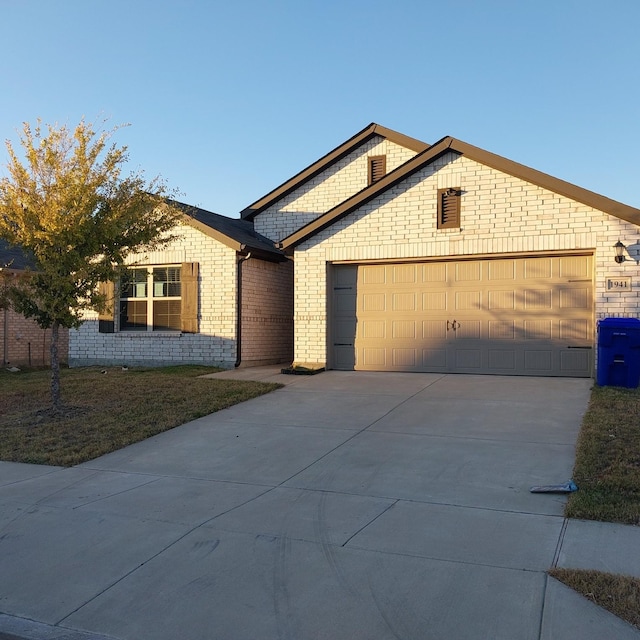 ranch-style home featuring a garage