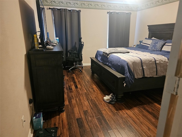 bedroom with dark wood-type flooring