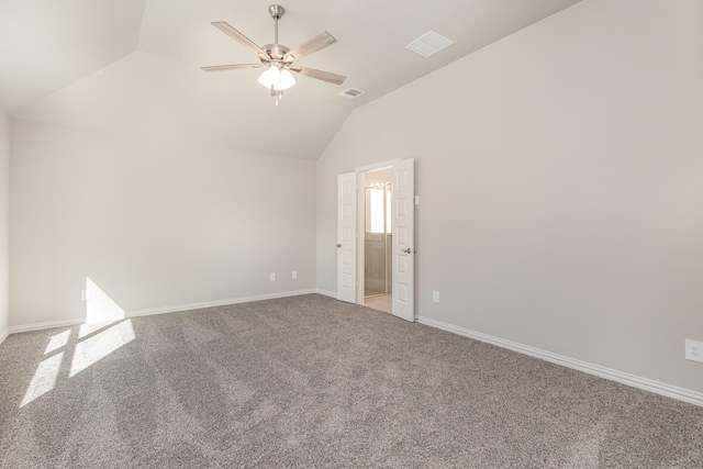 empty room featuring carpet, ceiling fan, and vaulted ceiling