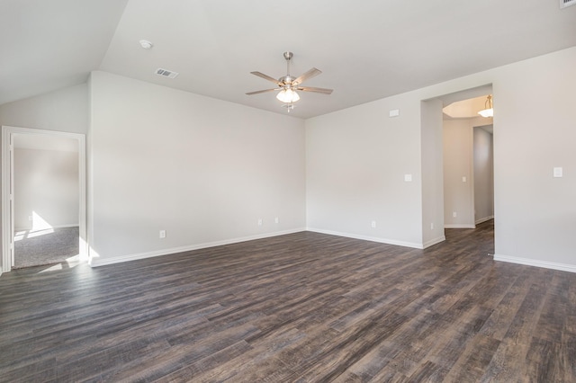 empty room with ceiling fan, lofted ceiling, and dark wood-type flooring