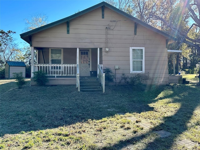 view of front of home featuring a front yard and a porch