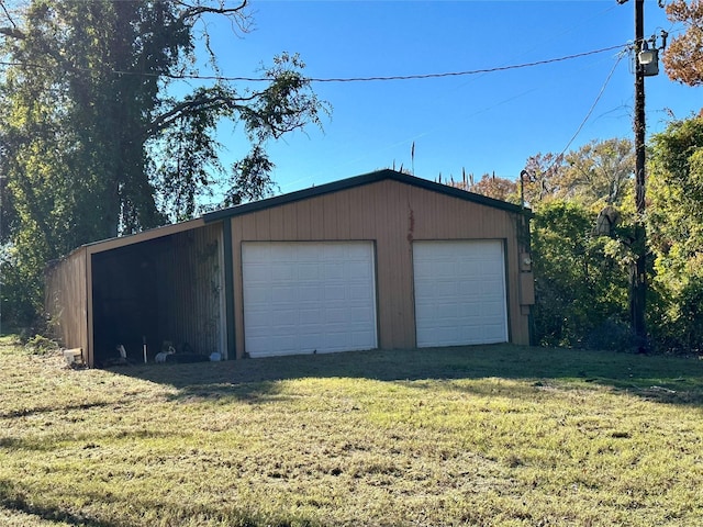 garage featuring a yard