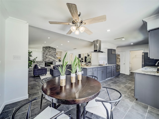 dining area featuring ornamental molding, ceiling fan, and lofted ceiling