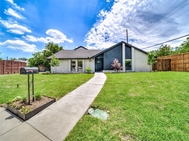 ranch-style home with a front yard