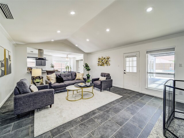 living room featuring vaulted ceiling, a wealth of natural light, crown molding, and ceiling fan