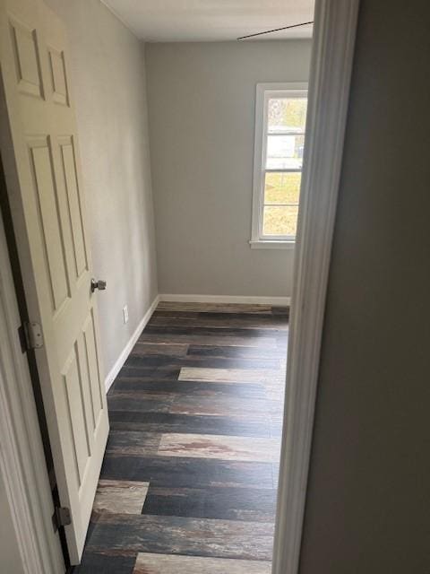 spare room with dark hardwood / wood-style floors