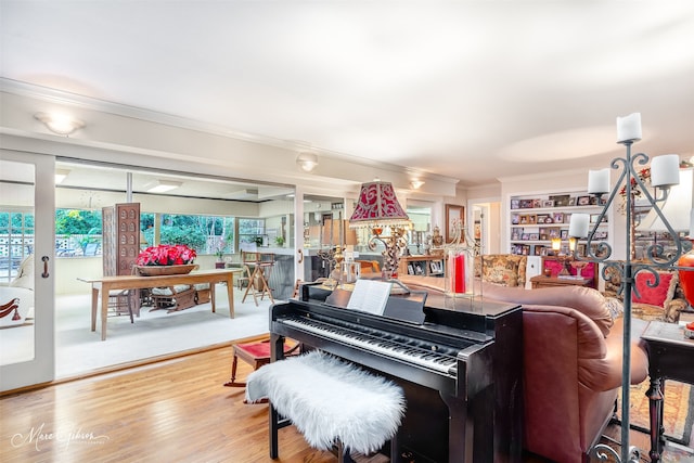 living room featuring ornamental molding and wood finished floors