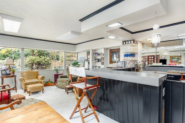 kitchen featuring dark cabinets and open floor plan