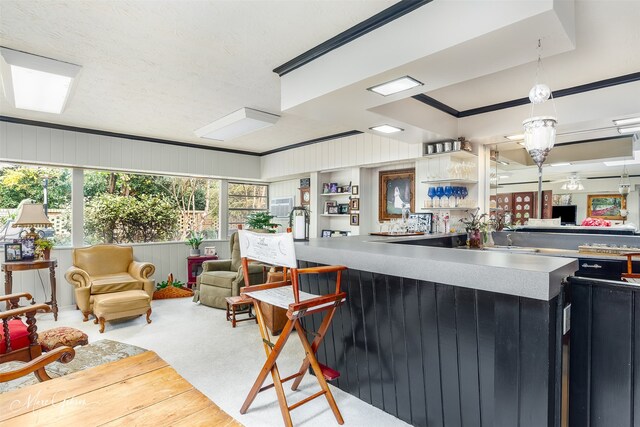424 Monrovia St, Shreveport, LA 71106 - kitchen featuring open floor plan, open shelves, hanging light fixtures, and a kitchen breakfast bar