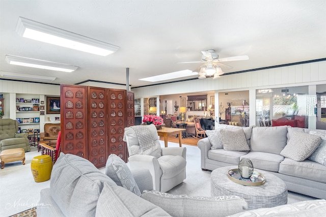 living area with a ceiling fan