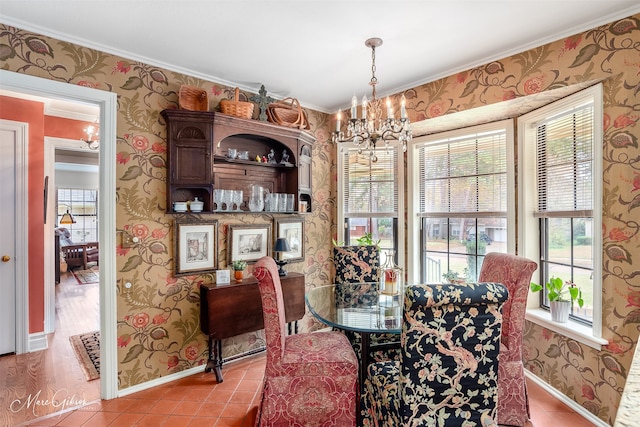 dining space with baseboards, light tile patterned floors, an inviting chandelier, and wallpapered walls