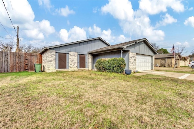 ranch-style house featuring a garage and a front lawn