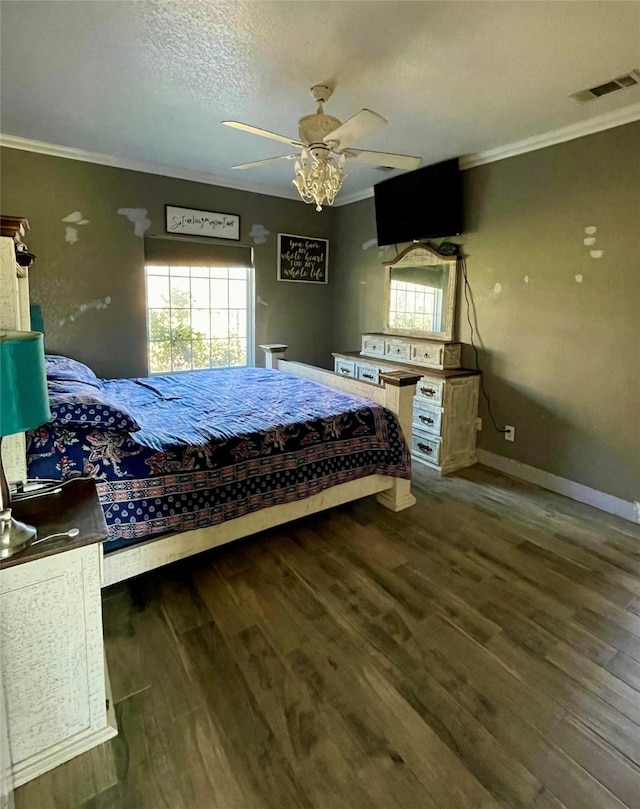 bedroom with ceiling fan, dark hardwood / wood-style flooring, a textured ceiling, and ornamental molding