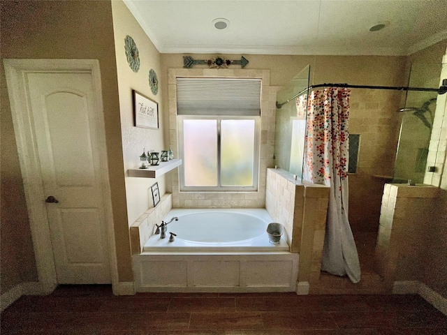 bathroom with wood-type flooring, ornamental molding, and independent shower and bath