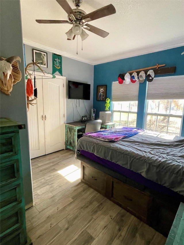 bedroom with ceiling fan, pool table, wood-type flooring, and ornamental molding