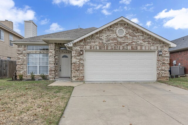 ranch-style house featuring a front yard, central AC, and a garage