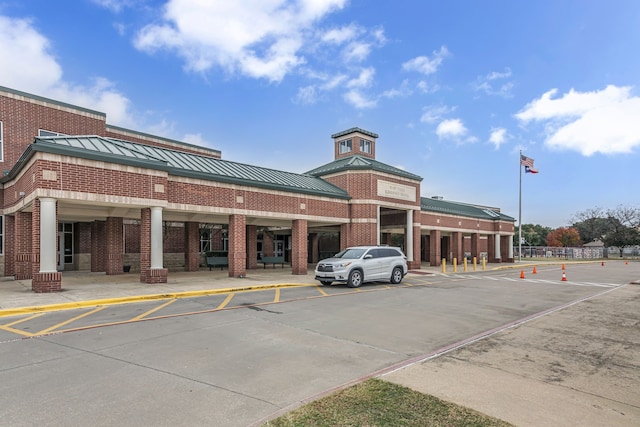 view of property with uncovered parking