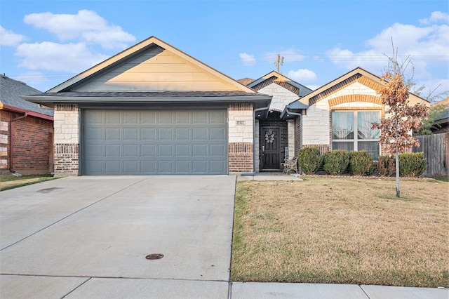 view of front of home with a garage and a front yard