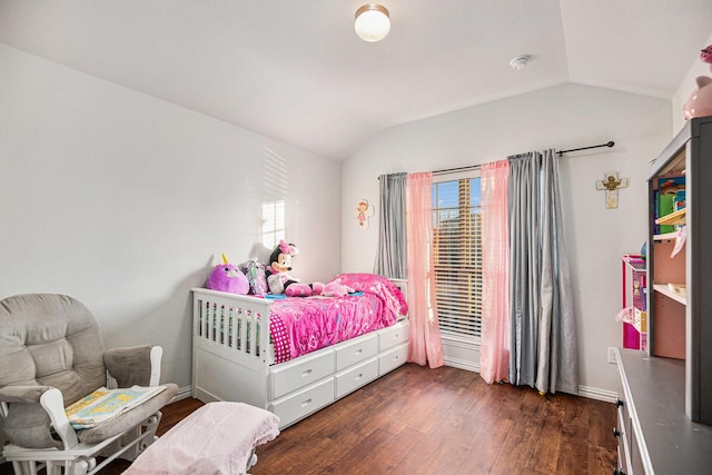 bedroom with dark hardwood / wood-style floors and vaulted ceiling