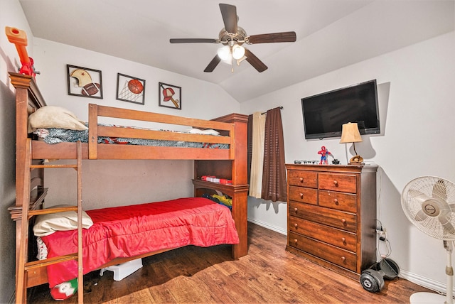 bedroom featuring ceiling fan, wood-type flooring, and vaulted ceiling