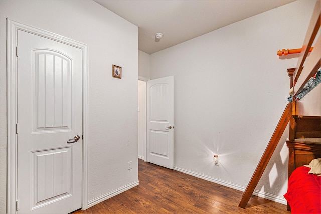 unfurnished bedroom featuring dark hardwood / wood-style flooring