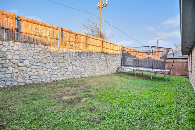 view of yard featuring a trampoline