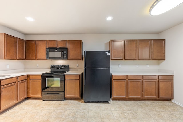 kitchen featuring black appliances and sink