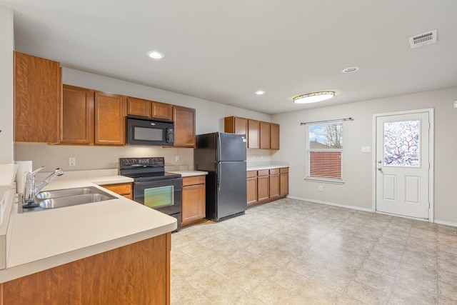 kitchen featuring black appliances and sink