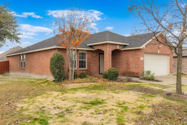 ranch-style home with a front yard and a garage