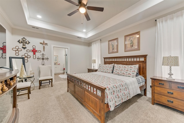 carpeted bedroom featuring ceiling fan, a raised ceiling, and crown molding