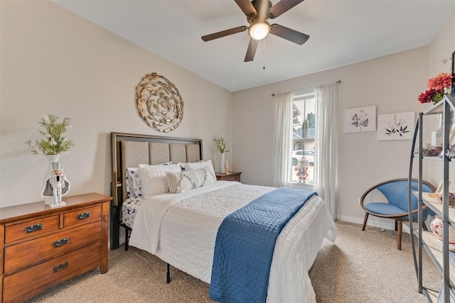 bedroom featuring light colored carpet and ceiling fan