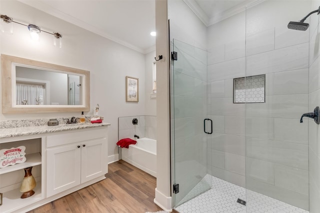 bathroom with hardwood / wood-style floors, vanity, crown molding, and independent shower and bath