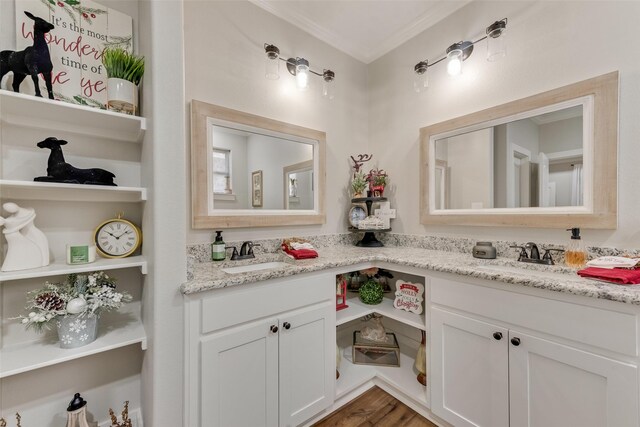 bathroom featuring hardwood / wood-style floors, vanity, and ornamental molding