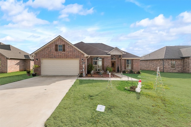 view of front of property featuring a garage and a front lawn