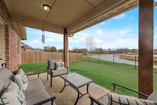 view of patio / terrace with outdoor lounge area and a water view