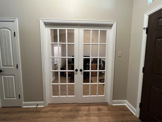 doorway to outside featuring french doors and hardwood / wood-style flooring