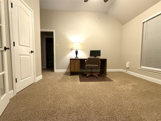 carpeted office featuring vaulted ceiling and ceiling fan