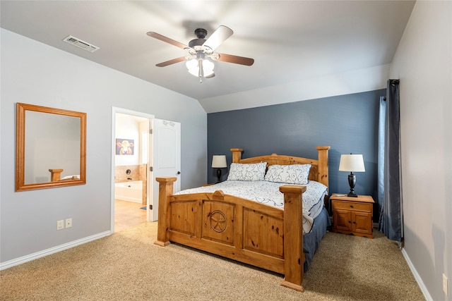 bedroom with light carpet, ensuite bathroom, ceiling fan, and lofted ceiling