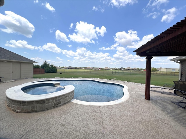 view of pool with a lawn, a patio area, and an in ground hot tub