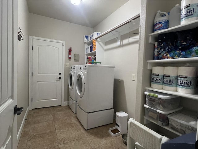 clothes washing area featuring washing machine and dryer