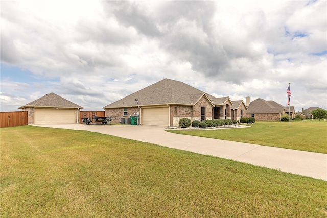 view of front of house featuring a front yard and a garage