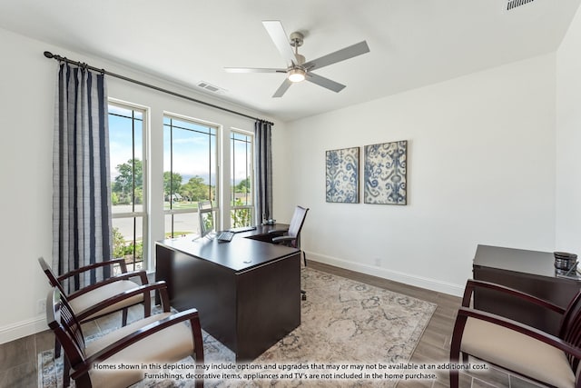 home office featuring ceiling fan and dark wood-type flooring