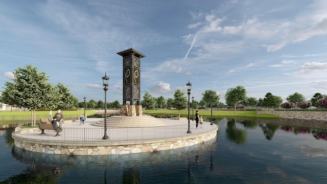 surrounding community featuring a water view